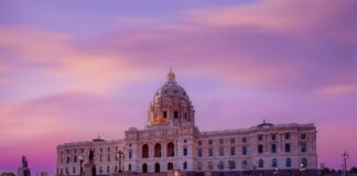Minnesota State Capitol building at sunset with a colorful sky
