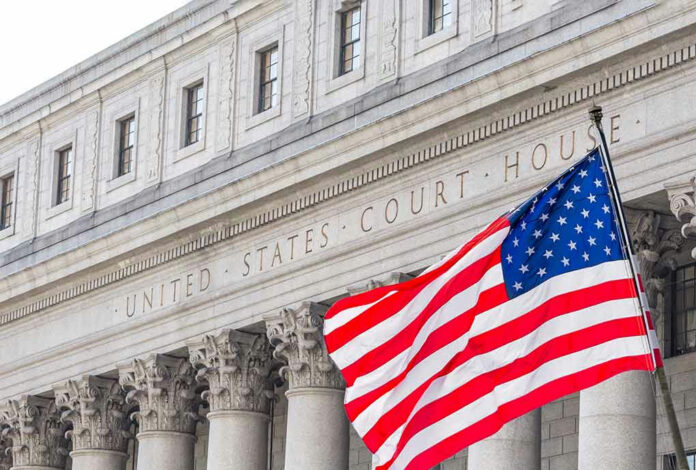 2231108363 United States courthouse with American flag waving.
