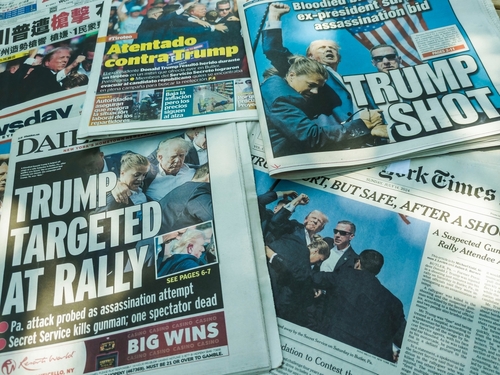 shutterstock_2488996835.jpg Various newspaper headlines reporting on an assassination attempt against Trump