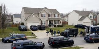 FBI agents conducting an operation in a suburban neighborhood
