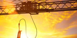 Person bungee jumping against a sunset backdrop
