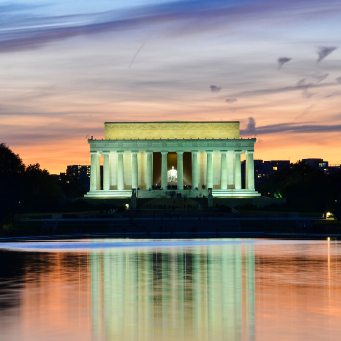 Abraham,Lincoln,Memorial,At,Night,-,Washington,Dc,,United,States Lincoln Memorial illuminated at sunset with reflection in water