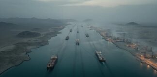 Aerial view of cargo ships navigating a shipping channel
