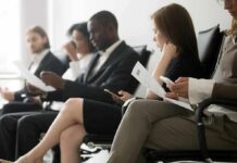 Ink-For-Interview Backlash Rattles SF Startup Job applicants seated in a waiting area reviewing documents