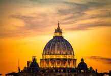 1976 Showdown Haunts Today’s Bishops St. Peter's Basilica dome at sunset