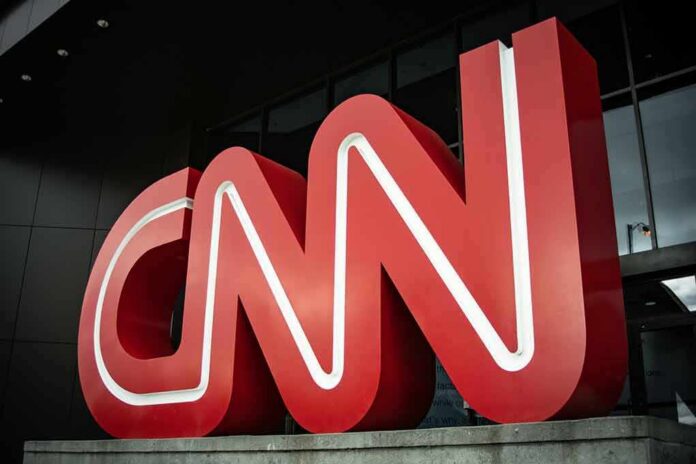 shutterstock_1648194340 Large red CNN logo outside a modern building entrance