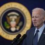 America’s 250th: Biden Booed, Trump Booms A man speaking in front of presidential seal.