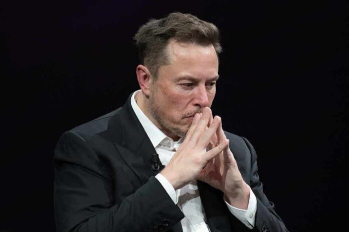 man in suit with hands steepled in thought