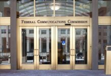 Federal Communications Commission building entrance with gold doors