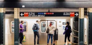 Commuters waiting on a subway platform