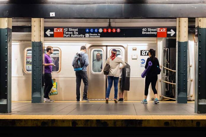 shutterstock_259538468 Commuters waiting on a subway platform