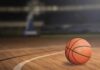 A basketball on a wooden court