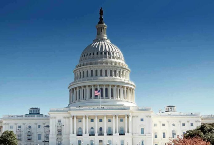 shutterstock_1034821033 United States Capitol building with dome under clear blue sky