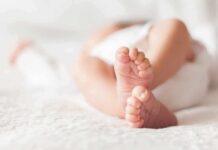 Bodycam Shock: Silence To Screams baby feet on a soft white blanket