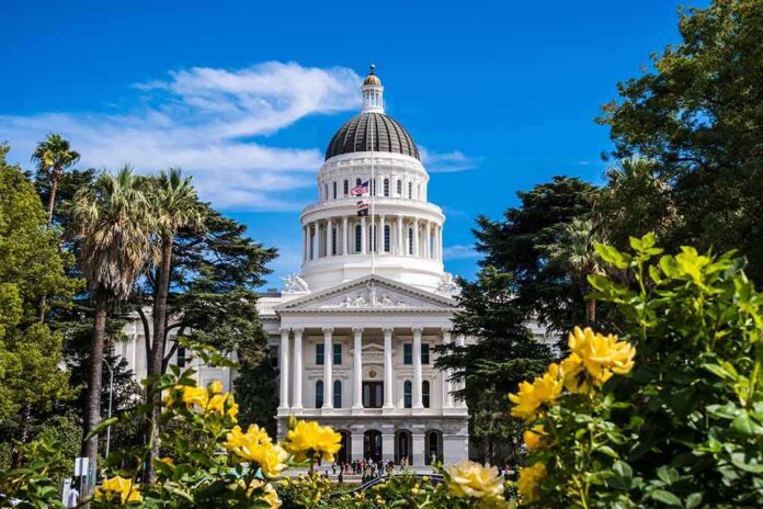 shutterstock_1189235845 Capitol building with white dome framed by trees and yellow flowers