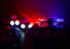 Repeat Thieves Hit Wall—25 Nabbed Police car light bar flashing red and blue at night