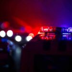 Repeat Thieves Hit Wall—25 Nabbed Police car light bar flashing red and blue at night