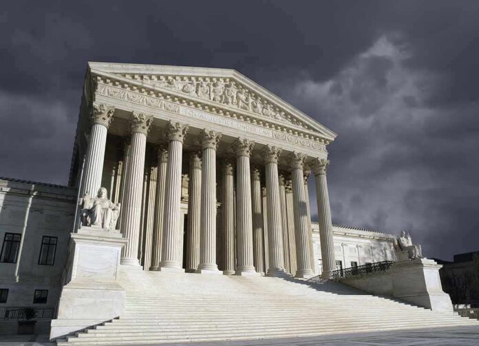 shutterstock_129998351 United States Supreme Court building with columns under stormy sky
