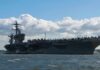 Combat Costs Force Tough Choices Behind The Scenes Aircraft carrier at sea with fighter jets on deck