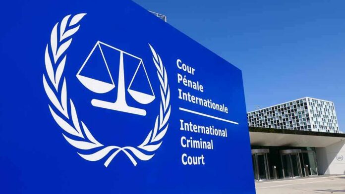shutterstock_1383842291 International Criminal Court sign with scales emblem outside modern building