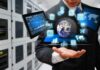 AI Stocks Hit Reality Check As Costs Climb Businessperson holding a digital tablet with floating data icons