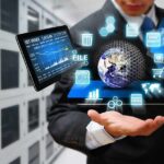 AI Stocks Hit Reality Check As Costs Climb Businessperson holding a digital tablet with floating data icons