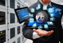Businessperson holding a digital tablet with floating data icons