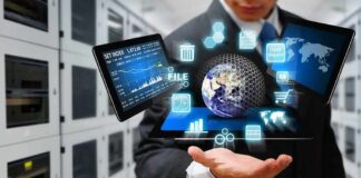 Businessperson holding a digital tablet with floating data icons
