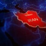A Dangerous Middle East Spiral Suddenly Pauses Iran highlighted on a digital map