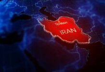 A Dangerous Middle East Spiral Suddenly Pauses Iran highlighted on a digital map