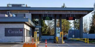 Canada border crossing booths with open and closed lane signs