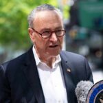 One Funding Decision Tears Open A Party Rift man in suit speaking at outdoor press event
