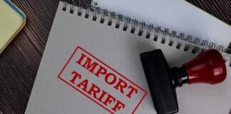 Notebook with import tariff stamp and red-handled rubber stamp