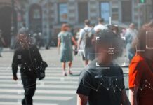 Biometric Dragnet Hits Italy’s Streets Crowd crossing a city street with digital tracking overlays