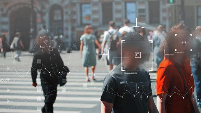 shutterstock_1783490738 Crowd crossing a city street with digital tracking overlays