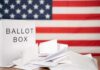 Michigan Meltdown After Razor-Thin Loss Ballot box with papers in front of an American flag