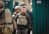 Anti-Graft Blitz Hammers Presidential Circle man in tactical vest walking with soldiers