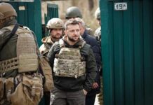Anti-Graft Blitz Hammers Presidential Circle man in tactical vest walking with soldiers