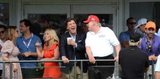 Group of spectators on a balcony at a golf event