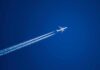 Transatlantic Flights Enter a New Climate Experiment Airplane leaving contrails in a clear blue sky