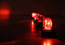 Trail Shutdown As Fire Jumps Ridges Row of red emergency beacons on a dark floor