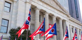Ohio flags outside a neoclassical government building