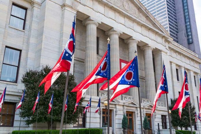 shutterstock_1141302074 Ohio flags outside a neoclassical government building