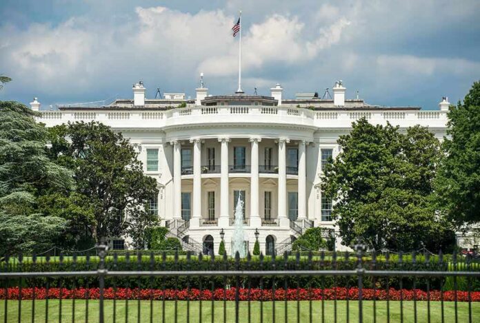 shutterstock_1198847647 The White House north facade behind a black iron fence