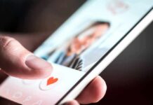 hand using a dating app on a smartphone