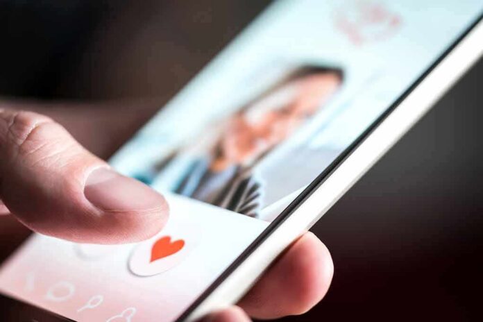 shutterstock_1204256557 hand using a dating app on a smartphone
