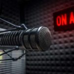 Joke Turned Headline Rattles Democrats Close-up of a studio microphone with an illuminated on-air sign