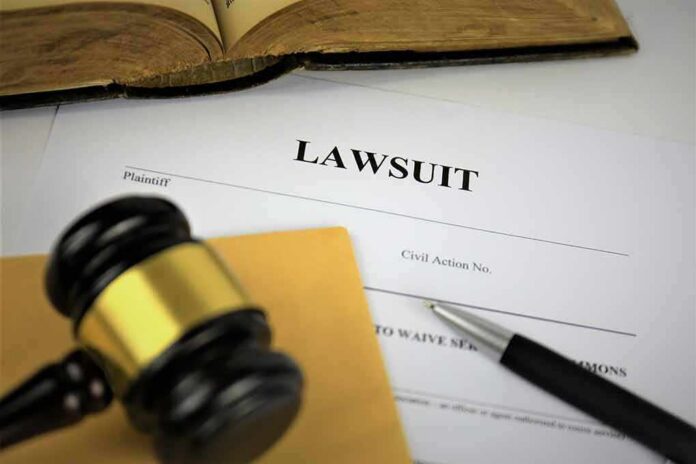 shutterstock_1236208948 Lawsuit documents with gavel, pen, and legal book