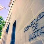 Department of Justice building facade with American flag