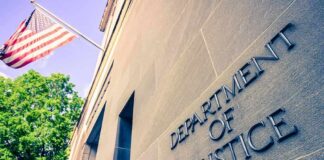 Department of Justice building facade with American flag